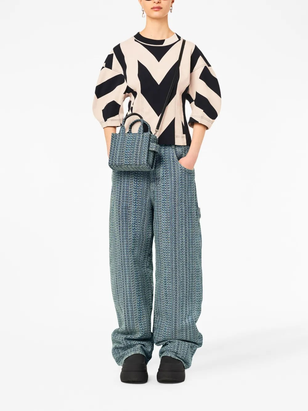 Blue bag worn by a person, showing the bag's fit