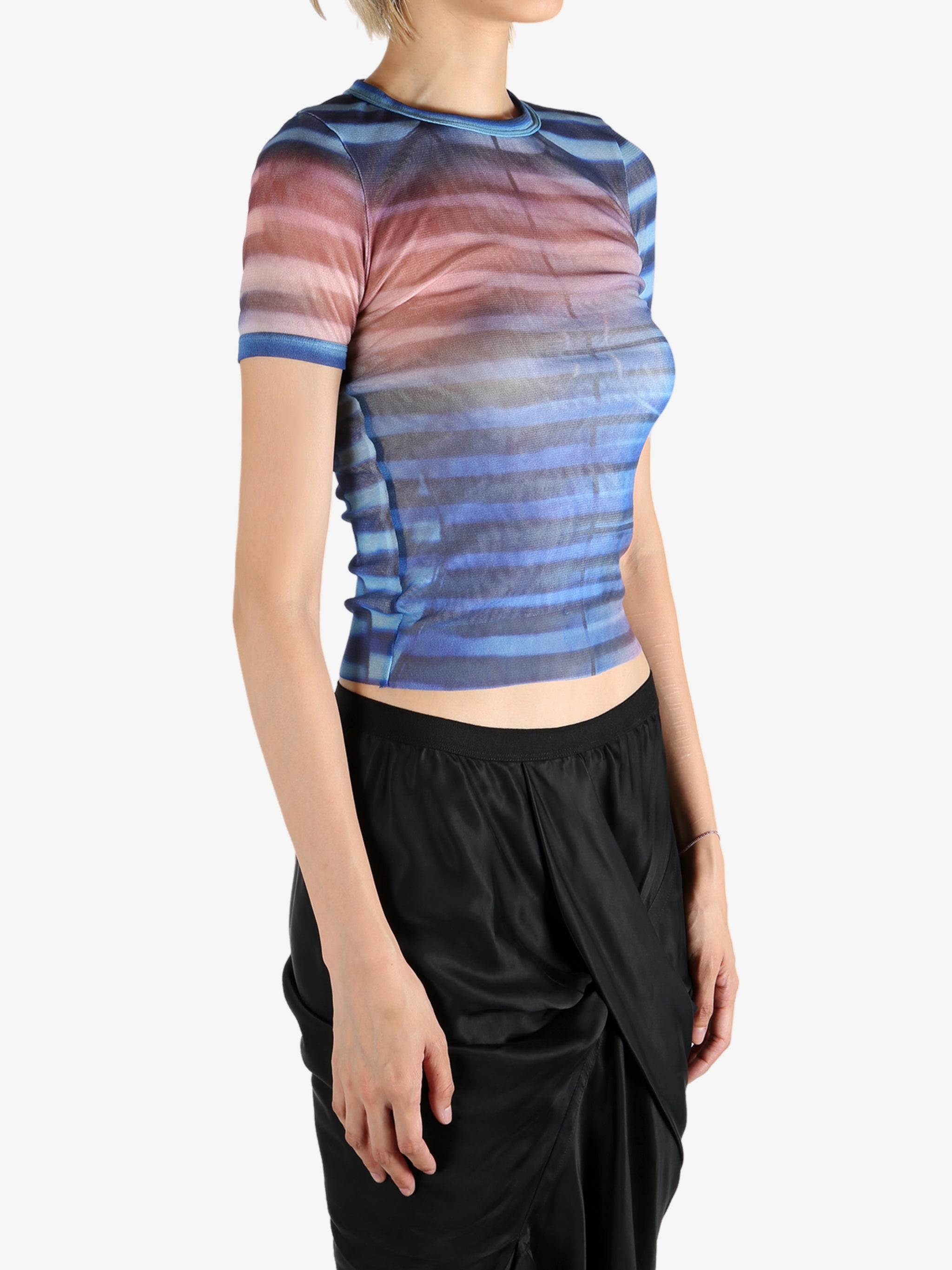 Blue t-shirt worn by a person, showing the shirt's fit