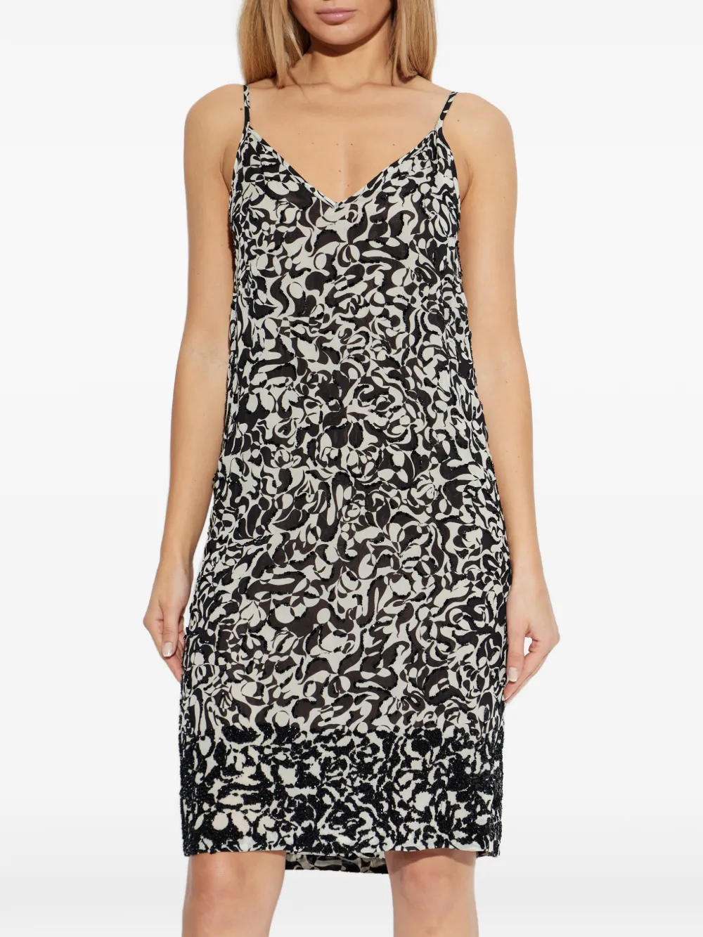 Black dress worn by a person, showing the dress fit