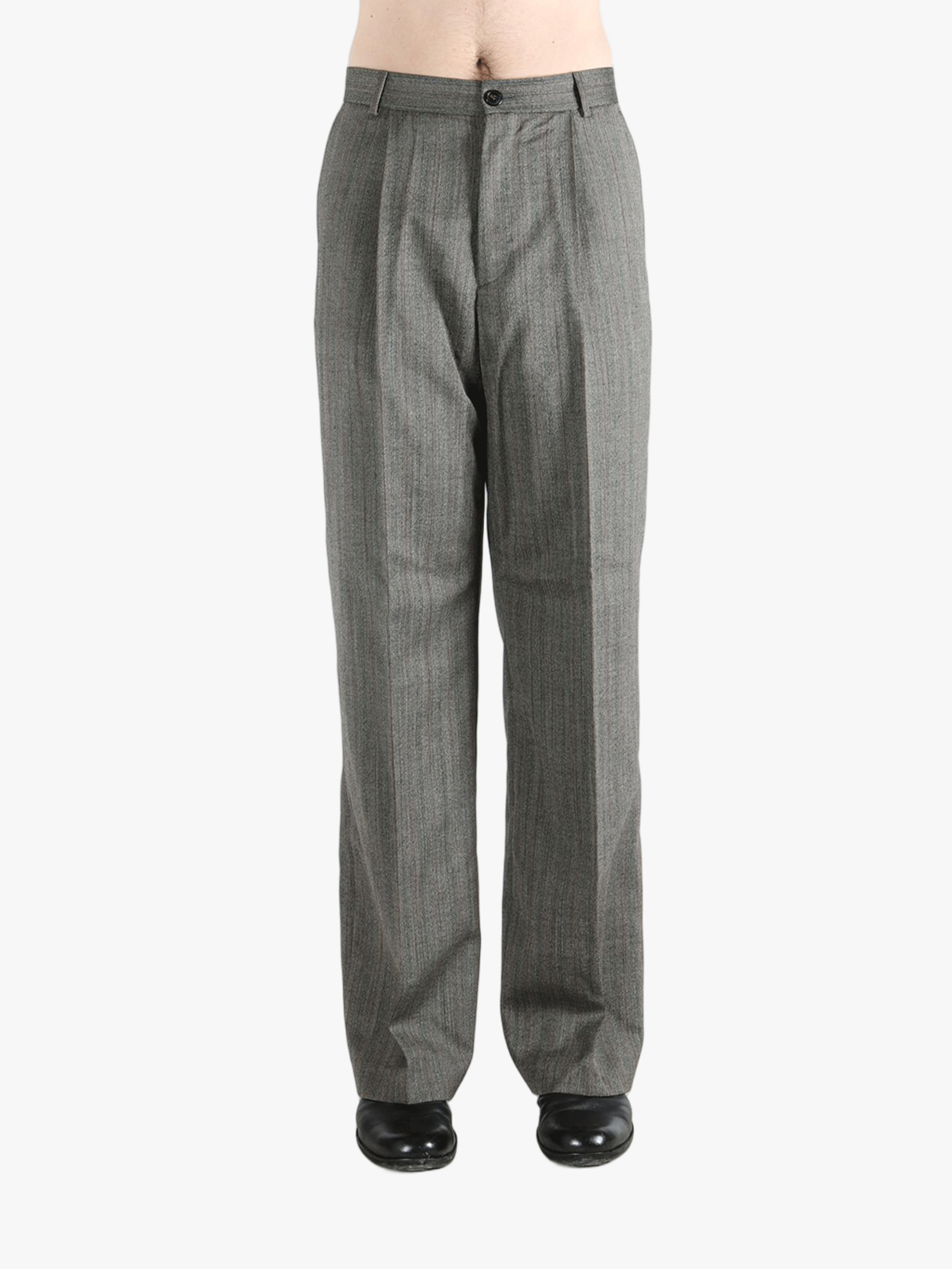 grey pants worn by a person, showing the pants fit