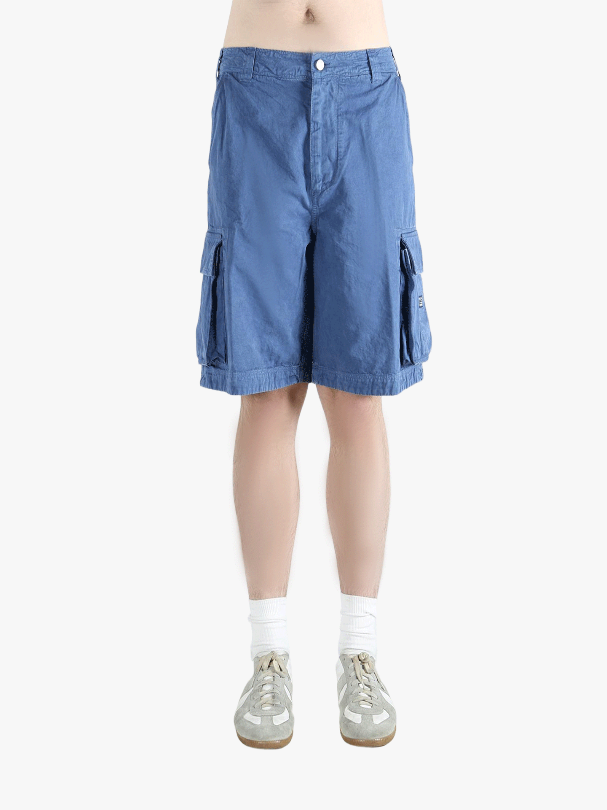 Blue shorts worn by a person,showing texture of the cotton fabric.