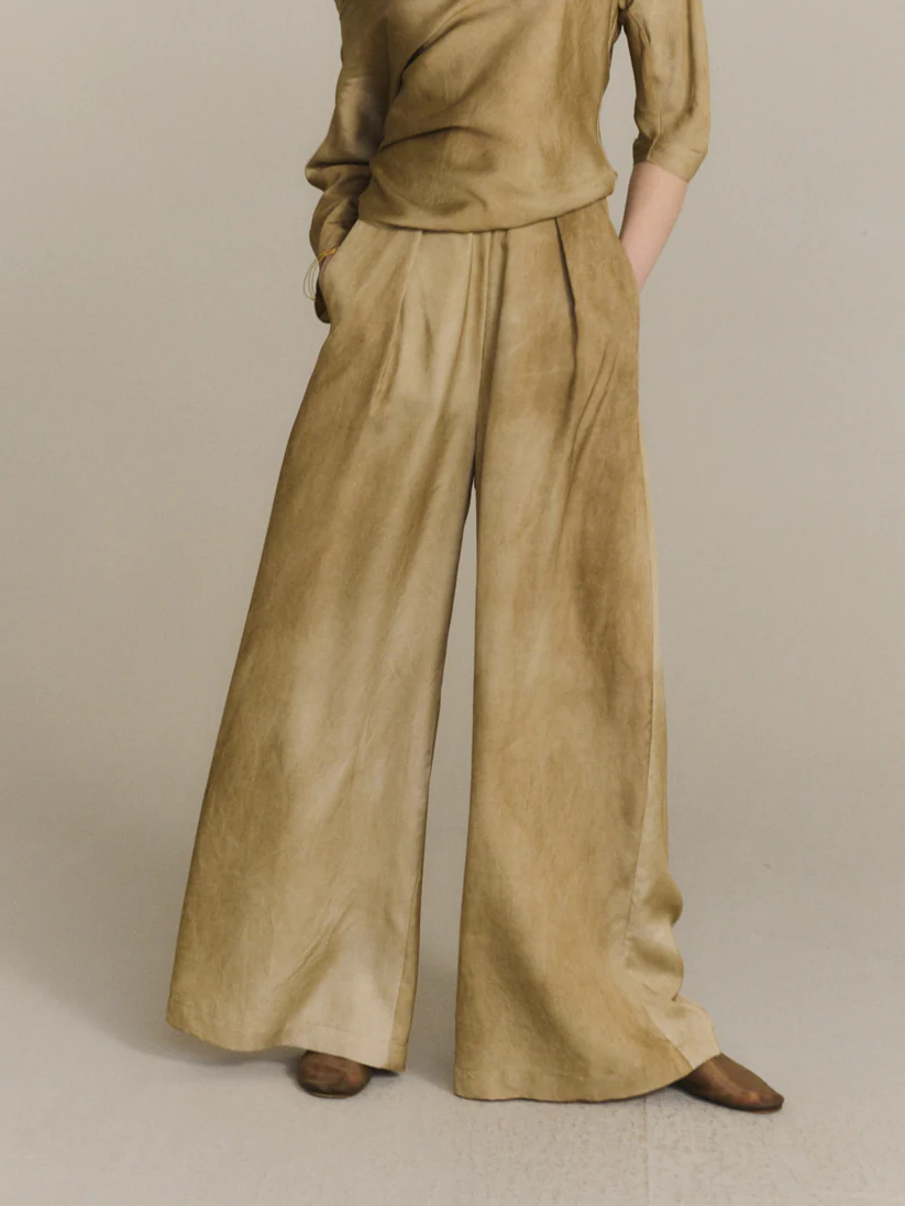 Tan pants worn by a person, showing the pants fit