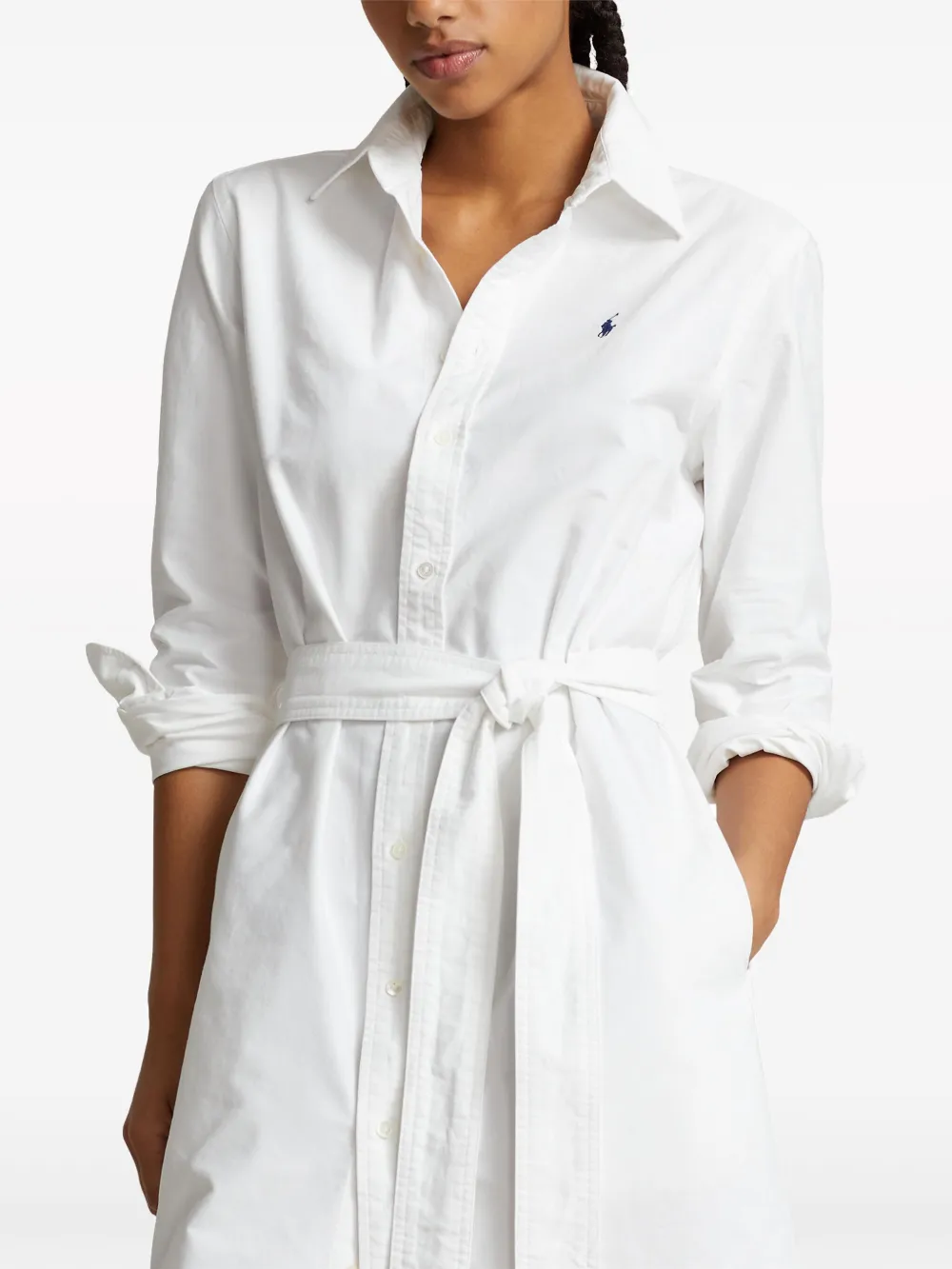 White shirtdress worn by a person, showing the shirtdress's fit