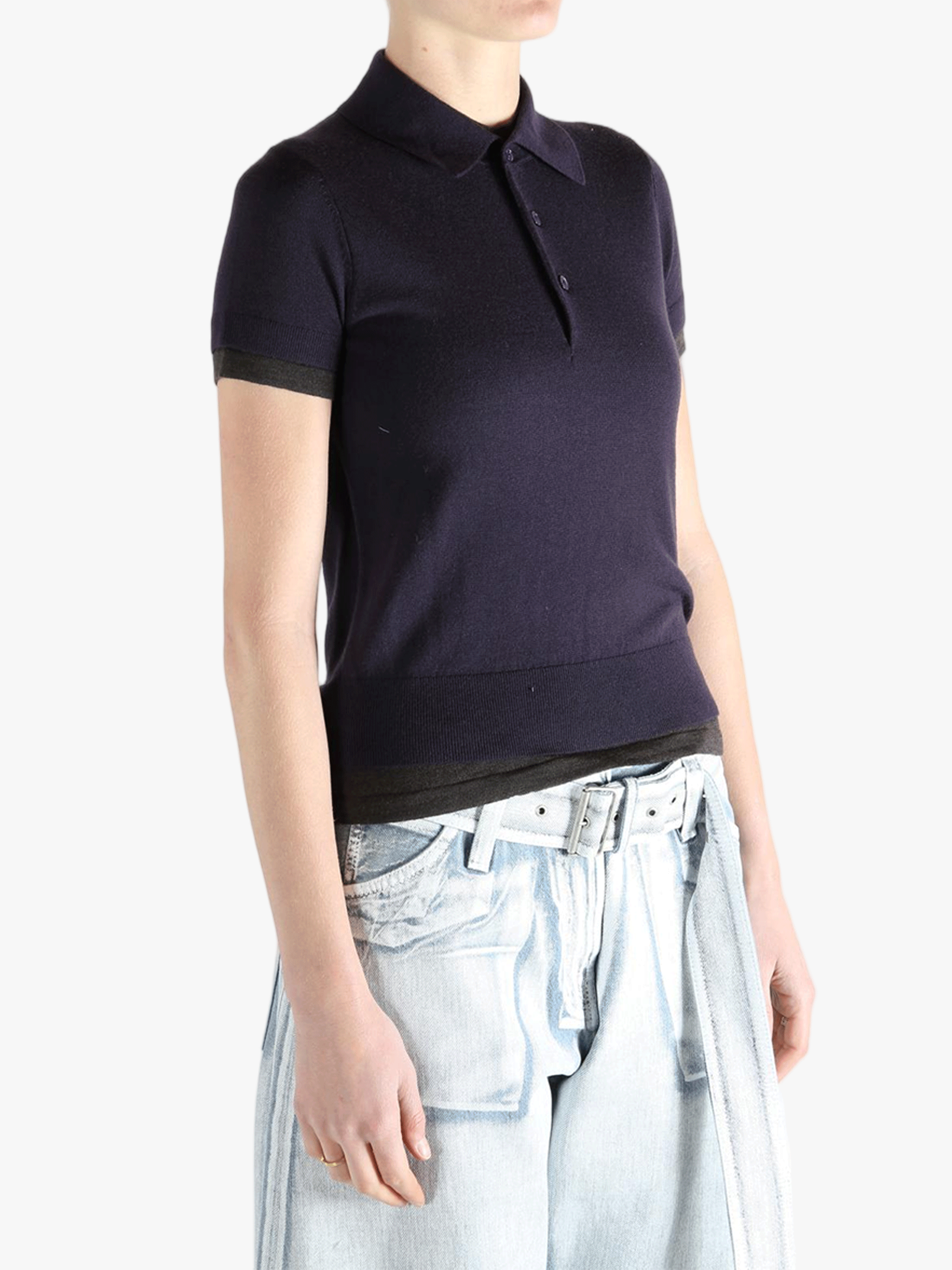 Purple knitwear worn by a person, showing the knitwear'fit