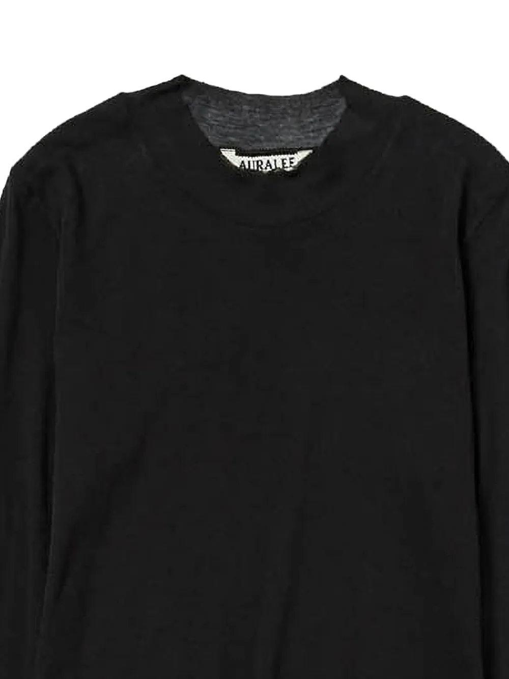 close up of black t-shirts, showing texture of the cotton fabric