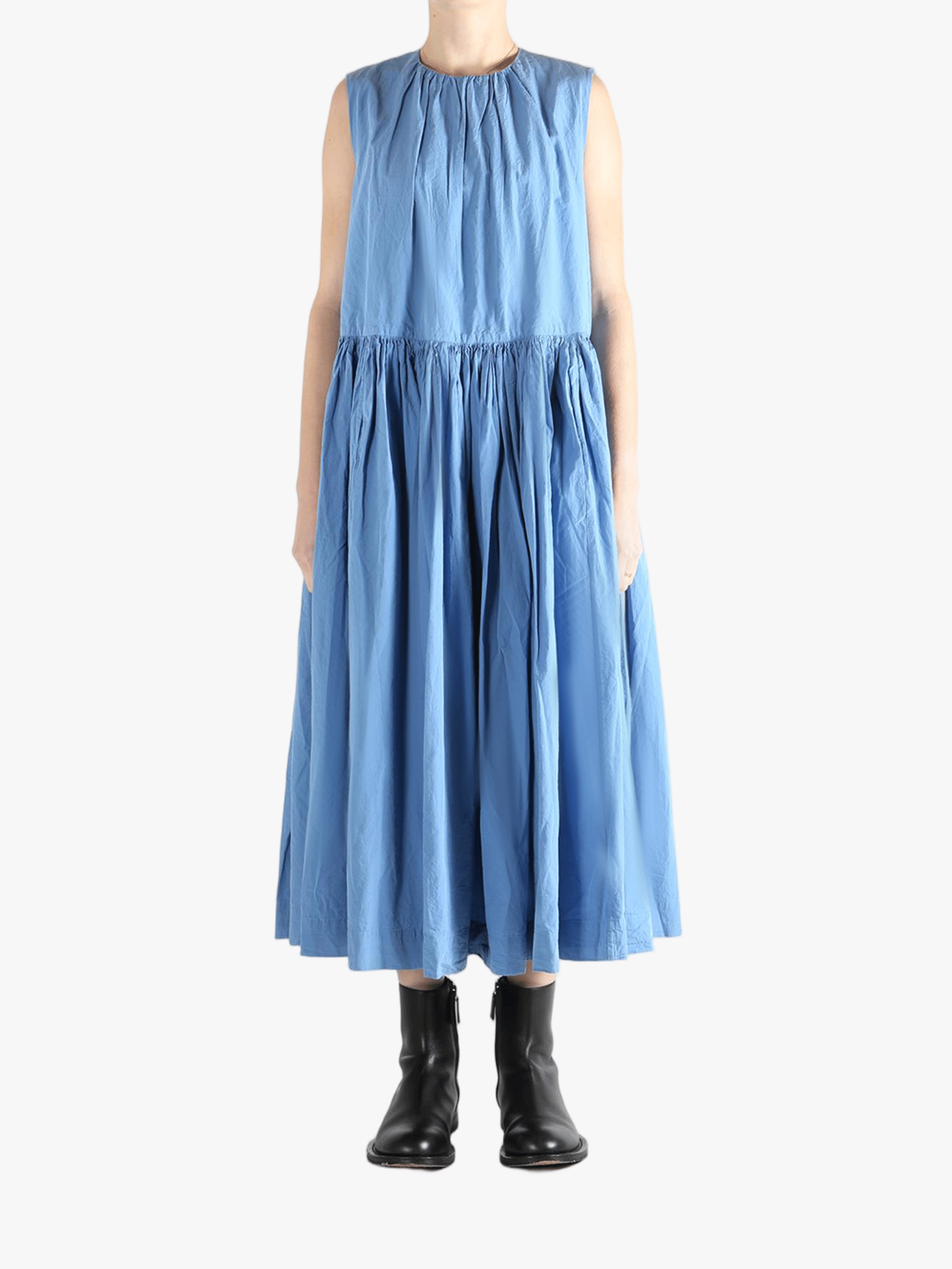 Blue dresses worn by a person, showing the dresses'fit