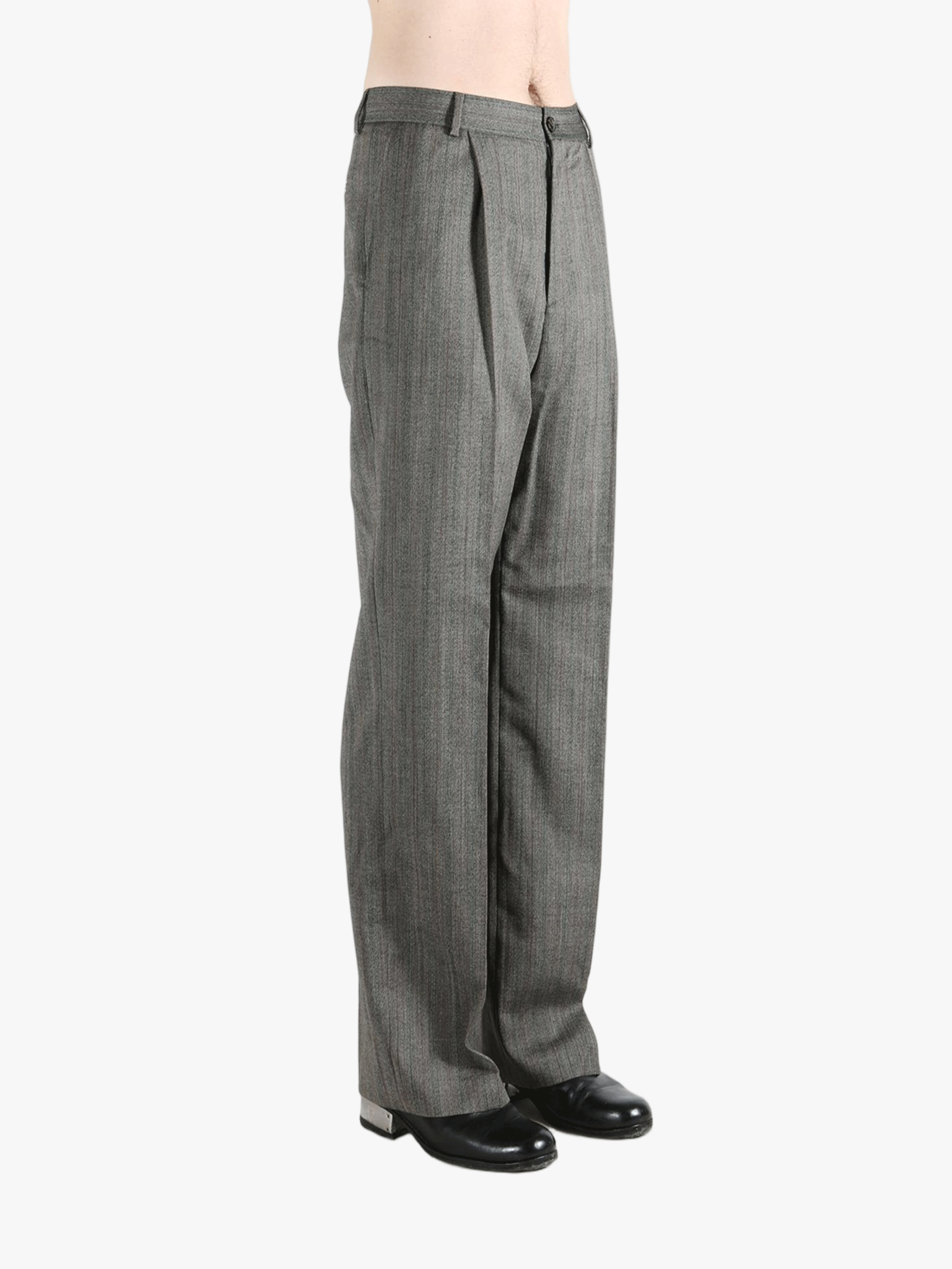 grey pants worn by a person, showing the pants fit